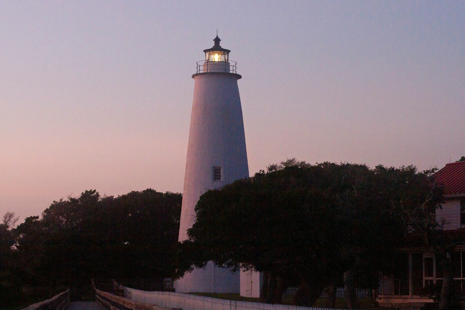 Ocracoke Island lighthouse silhouetted against a dusk sky on the Outer Banks
