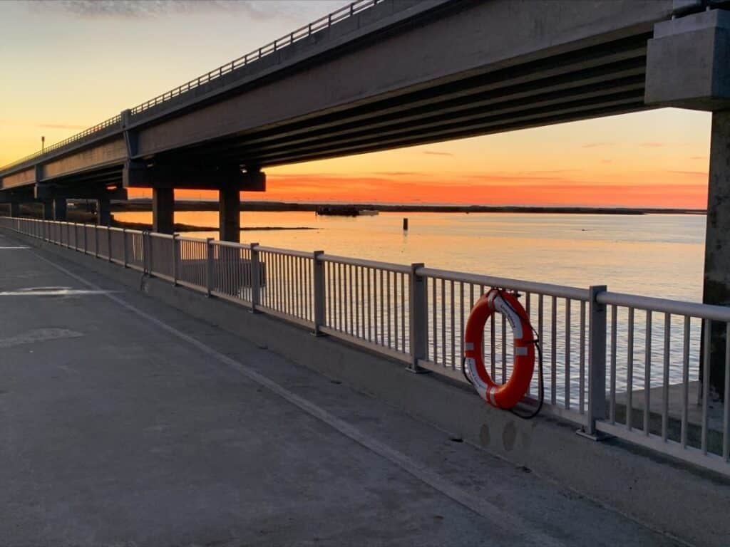 Sunrise over the water beside the old Bonner Bridge fishing pier at Oregon Inlet.